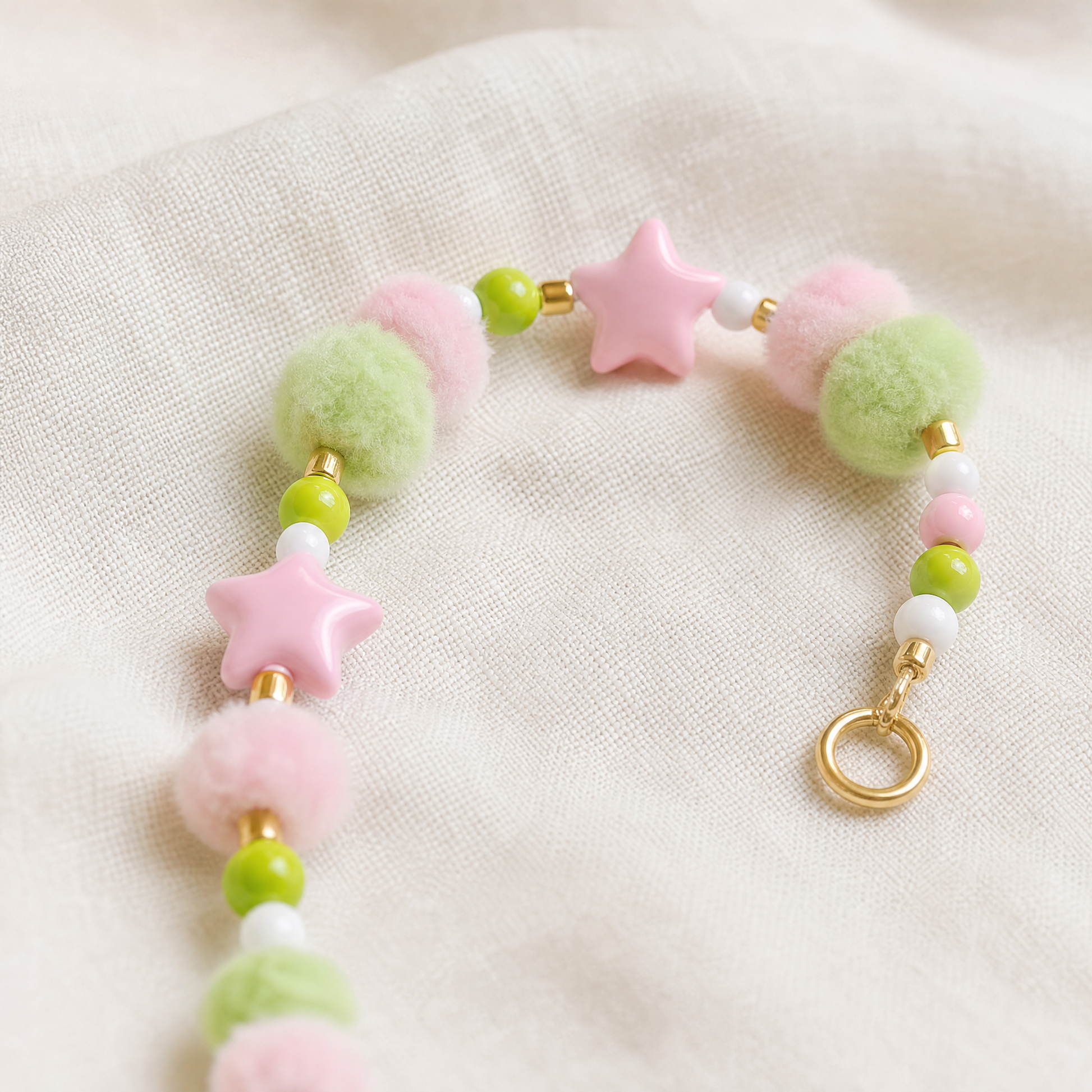 Detachable pom-pom, star and bead charm section